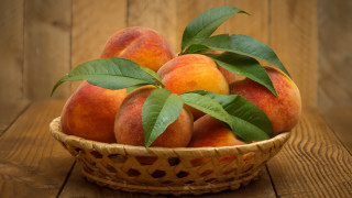 Basket peaches leaves wooden table 2 - free aesthetic wallpaper