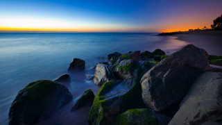 Mystical beach rocks water sunset 2 - free summer wallpaper