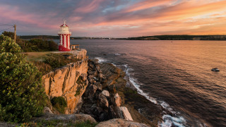 Lighthouse cliff ocean sunset boat 2 - the water below free wallpaper
