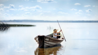 Lake boat man clouds portrait - a man in a boat free wallpaper