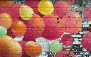 Brick wall painting oranges apples - free autumn wallpaper