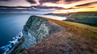 Cliff ocean sunset landscape planet - carl critchlow free wallpaper