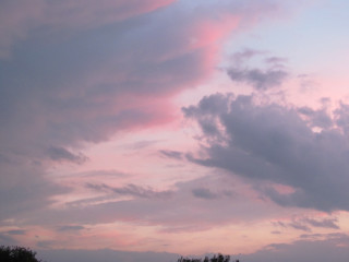 Pink clouds cityscape horizon dusk - free airplane wallpaper