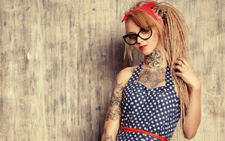 Woman tattoo glasses redbow beach - against a wall free wallpaper