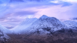 Snowy mountain range cloudy sky 5 - snow under a cloudy sky free wallpaper