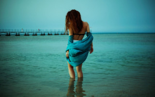 Woman blue towel beach sea - a blue towel free wallpaper