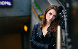 Woman blackjacket leaning wall bokeh - annabel eyres free wallpaper for desktop