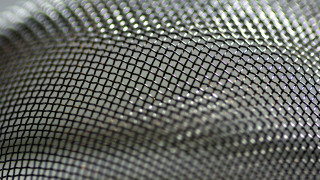 Metal mesh honeycomb blurry background - mesh wire free wallpaper