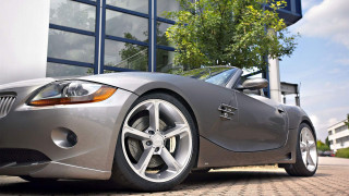 Silver sports car building tree - a tree in the background free wallpaper for desktop