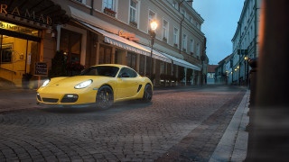 Yellow sports car cobblestone street - adam szentpétery free wallpaper