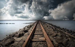 Train water clouds bridge mountain - the water under a cloudy sky free wallpaper