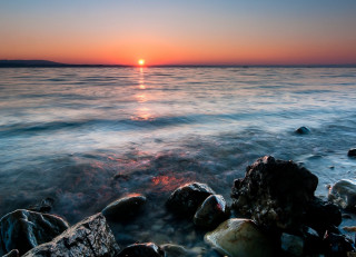 Sunset ocean rocks water island 2 - distant free wallpaper