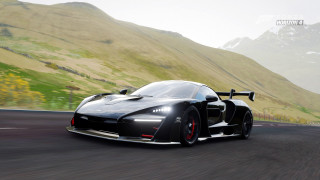 Black sports car mountain green - a road in front free wallpaper