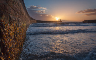 Sunset ocean waves lighthouse cloudy 2 - free beach wallpaper