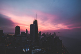 City skyline dusk purple pink - sky in the background free wallpaper for desktop