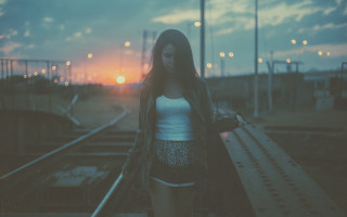 Woman sunset traintrack suitcase outstretched - a suitcase free wallpaper