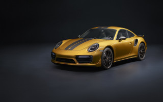 Yellow porsche sports car dark - a black background behind free wallpaper