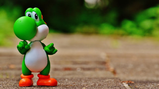 Green dinosaur road trees grass - a toy figure free wallpaper