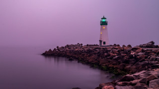Lighthouse rocky shore green light - a lighthouse free wallpaper