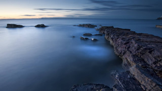 Lighthouse rocks longexposure mountains ocean - rich moody colours free wallpaper