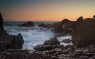 Rocky beach wave sunset clouds - allan brooks free wallpaper