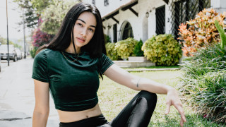 Woman green shirt black pants - free aesthetic wallpaper