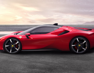 Red sports car mountains water - side profile free wallpaper