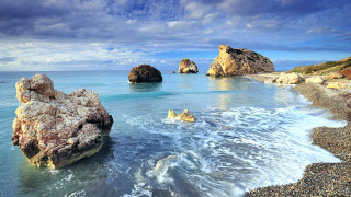 Rocky beach large formation water - a large rock formation free wallpaper