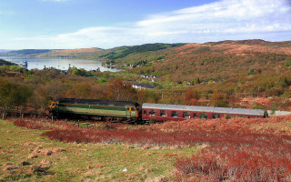 Train lake mountains green countryside - a train traveling free wallpaper