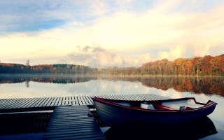 Docked boat lake trees clouds 2 - tranquil free wallpaper
