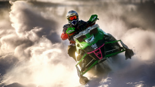 Snowmobile rider cloudy sky helmet - cloud behind them free wallpaper