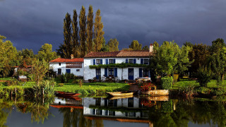 Lake house boat trees sky - a dark sky free wallpaper