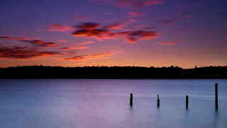 Sunset lake hill clouds orange - a sunset over a lake free wallpaper