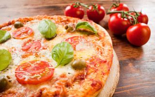 Pizza tomatoes basil wooden table - a pizza free wallpaper
