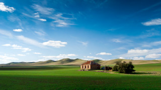 House field mountains sky clouds 2 - a house in a field free wallpaper