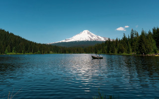 Lake mountain trees boat sky - a mountain in the background and trees free wallpaper