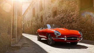 Red sports car stone building - a sunbeam free wallpaper