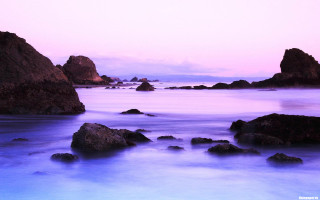 Rocky beach purple sky water - a purple sky and water free wallpaper