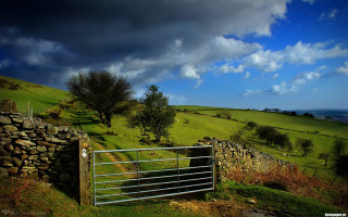 Gate grassy field stone wall - stormy weather free wallpaper
