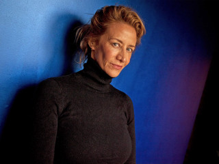 Woman black turtleneck blue wall - hypermodernism free wallpaper