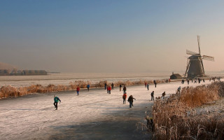 Skating winter flemish baroque windmill - a windmill in the distance free wallpaper
