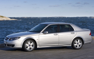 Silver car pier ocean rock - a silver car free wallpaper