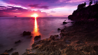 Sunset ocean rocks water purple 2 - a purple sky in the background free wallpaper