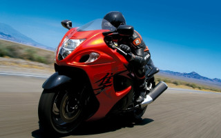 Red motorcycle desert mountains sky - a red motorcycle free wallpaper