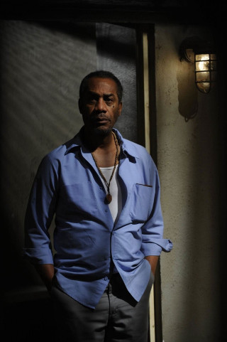 Man standing doorway hands pockets - derold page free wallpaper for mobile