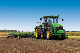 Tractor plowing field green yellow - a tractor free wallpaper