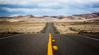 Deserted road mountains cinematic beach - straight free wallpaper