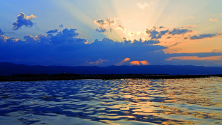 Sunset boat bridge city mountain - a sky in the background free wallpaper