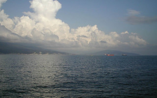 Lake mountains cloudy sky boat - panoramic view free wallpaper