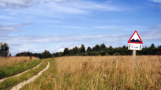 Road sign field trees clouds - david inshaw free wallpaper